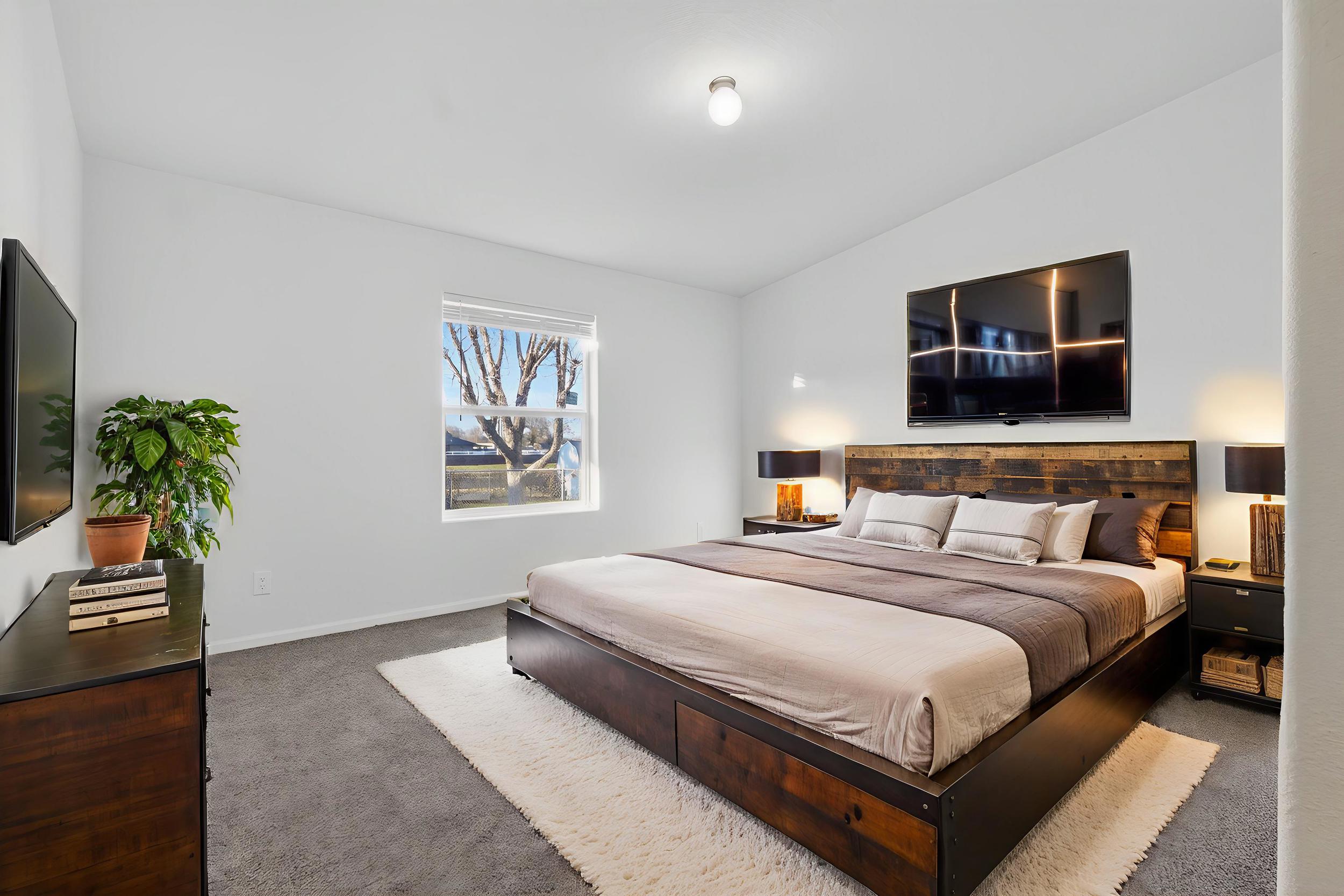 *Virtually staged* Bedroom with carpet floors and lofted ceiling