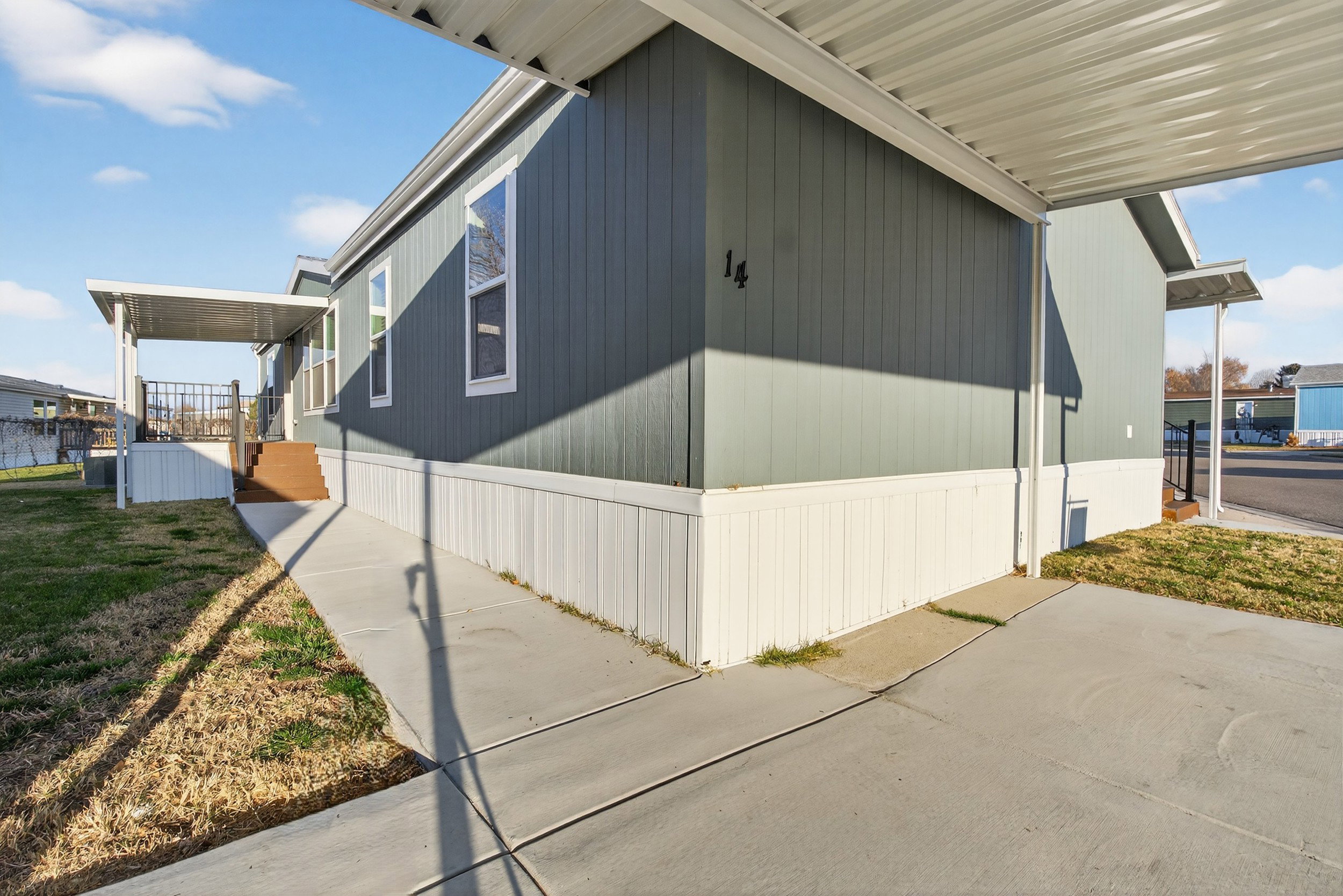 View of property exterior with a yard