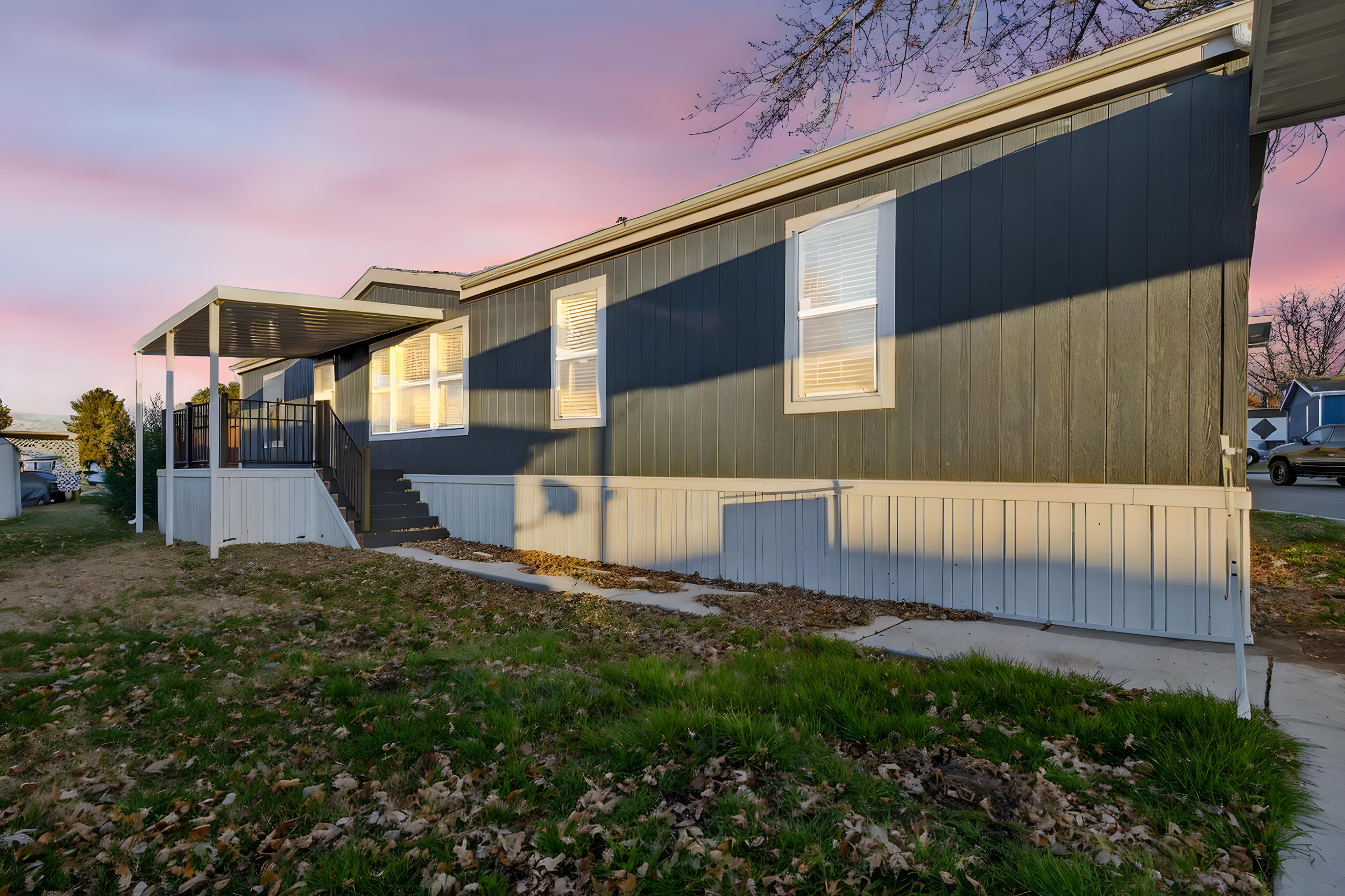 View of property exterior at dusk