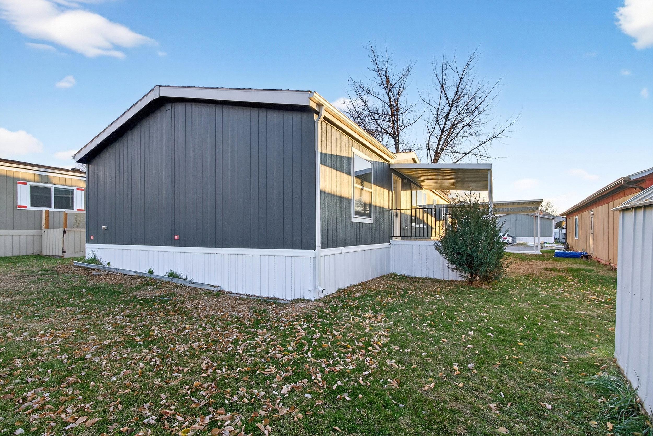 View of property exterior featuring a yard