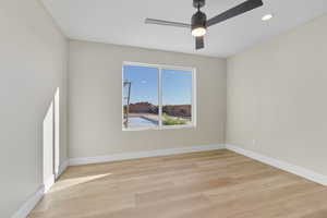Spare room featuring light wood finished floors, recessed lighting, and a ceiling fan