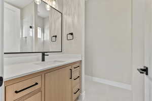 Bathroom with vanity and light tile patterned flooring