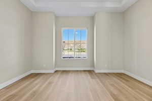 Empty room with light wood finished floors