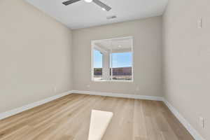 Spare room with light wood-style flooring