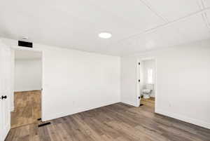 Unfurnished master room with wood finished floors and baseboards