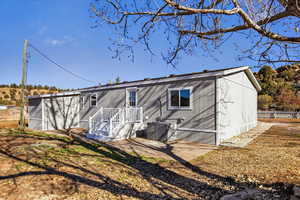 Rear view of house with a patio area