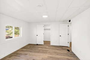 Unfurnished master bedroom featuring light wood finished floors and recessed lighting