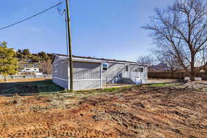 View of side of home with a fenced backyard