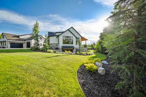 View of front facade with stone siding and board and batten siding