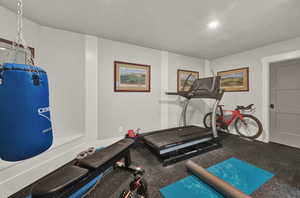 Exercise area featuring rubber floors