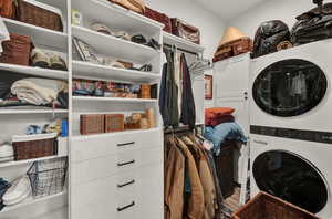 Laundry area with estacked washer and dryer and cabinet space