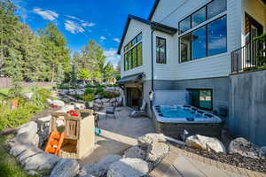 View of patio featuring a hot tub