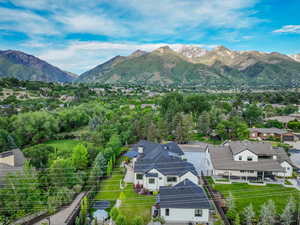 Aerial view of residential area featuring a mountainous background