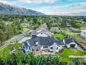 Aerial perspective of suburban area featuring a mountainous background