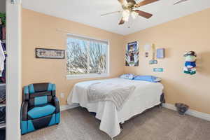 Bedroom featuring carpet and ceiling fan