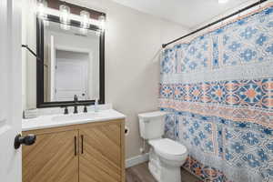 Full bath featuring vanity and a shower with curtain