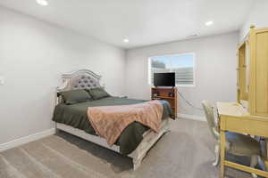 Carpeted bedroom featuring recessed lighting