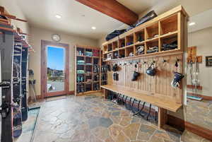 Mudroom featuring stone flooring and recessed lighting