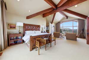 Bedroom featuring light colored carpet, recessed lighting, and a mountain view