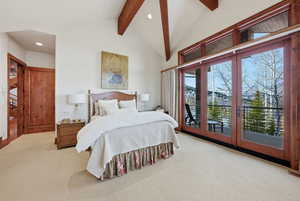 Carpeted bedroom featuring access to outside, recessed lighting, beamed ceiling, and high vaulted ceiling