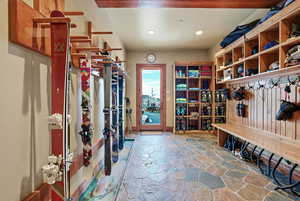 Mudroom featuring stone tile floors and recessed lighting
