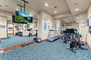Exercise room featuring recessed lighting