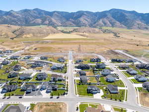 Aerial view of residential area featuring a mountain backdrop