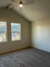 Unfurnished room with ceiling fan and carpet floors