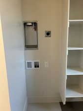 Washroom featuring washer hookup and baseboards