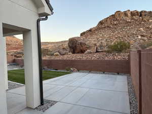 Fenced backyard with a patio