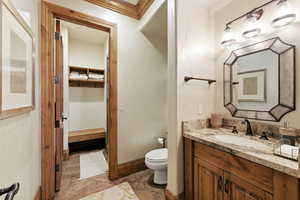 Bathroom featuring vanity and toilet