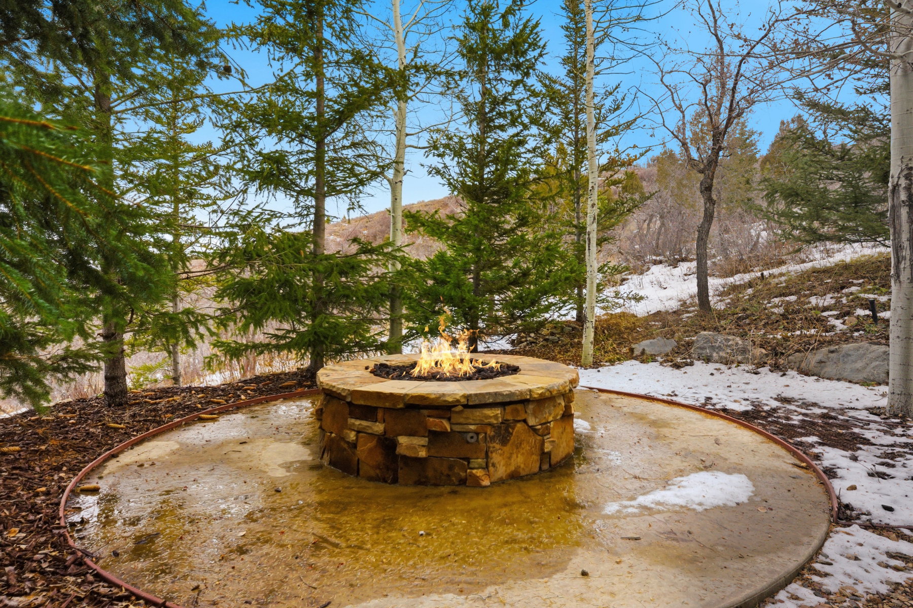 View of yard with an outdoor fire pit