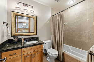 Full bath with vanity and shower / bathtub combination with curtain