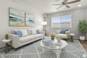 Living area with a ceiling fan, recessed lighting, and wood finished floors
