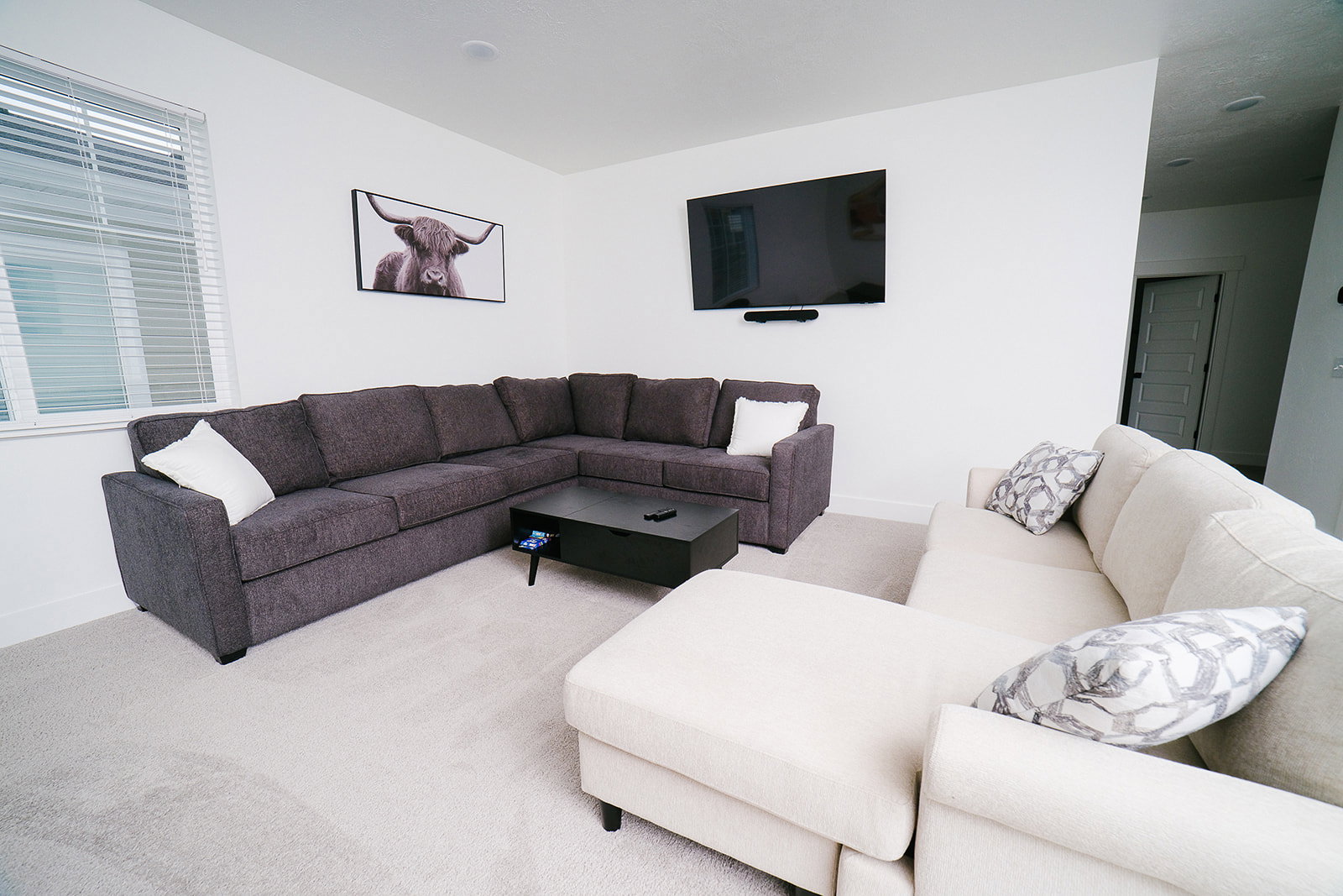Carpeted living room with baseboards
