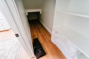 Corridor featuring light wood finished floors and baseboards