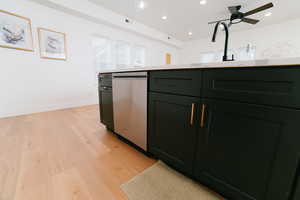 Kitchen with light wood-type flooring, dishwasher, a ceiling fan, green cabinets, and recessed lighting