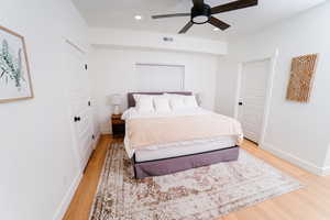 Bedroom with a ceiling fan, light wood-type flooring, and recessed lighting