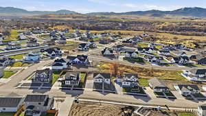 Aerial perspective of suburban area with a mountainous background