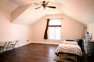 Sitting room with dark wood-style floors and ceiling fan