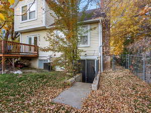 Back of property featuring a wooden deck