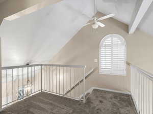 Hallway featuring carpet flooring