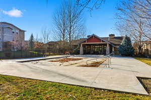 View of property's community featuring a porch and a swimming pool