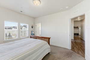 Carpeted bedroom with baseboards