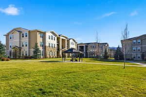 Surrounding community featuring a gazebo and a lawn