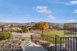 View of grassy yard with a residential view and a mountain view