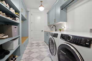 Laundry area with washing machine and dryer and cabinet space