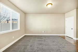 Unfurnished room with baseboards