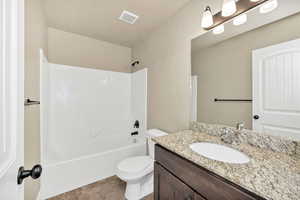 Full bath with vanity and bathtub / shower combination