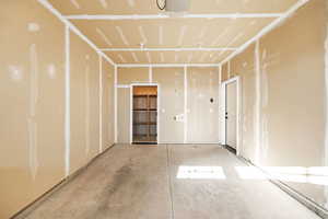 Empty room featuring concrete flooring